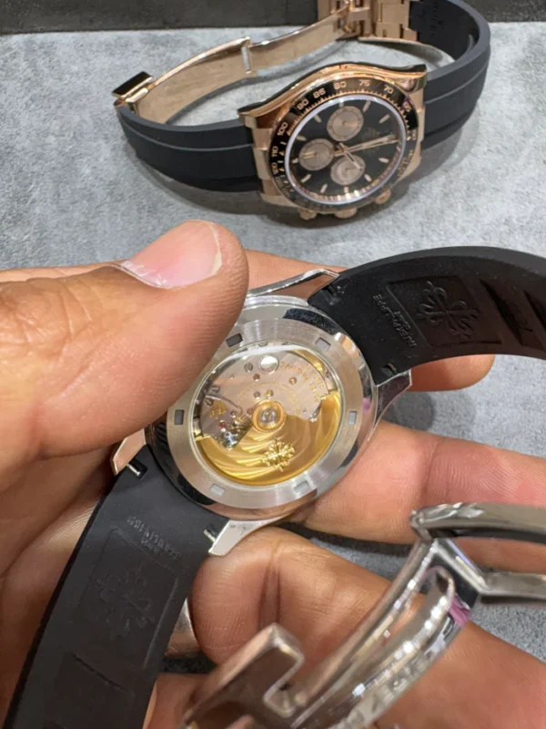 Buy Patek Philippe Nautilus 40mm in 18KT white gold with grey dial and uncut rubber strap. Iconic luxury sports watch. Guaranteed authentic.